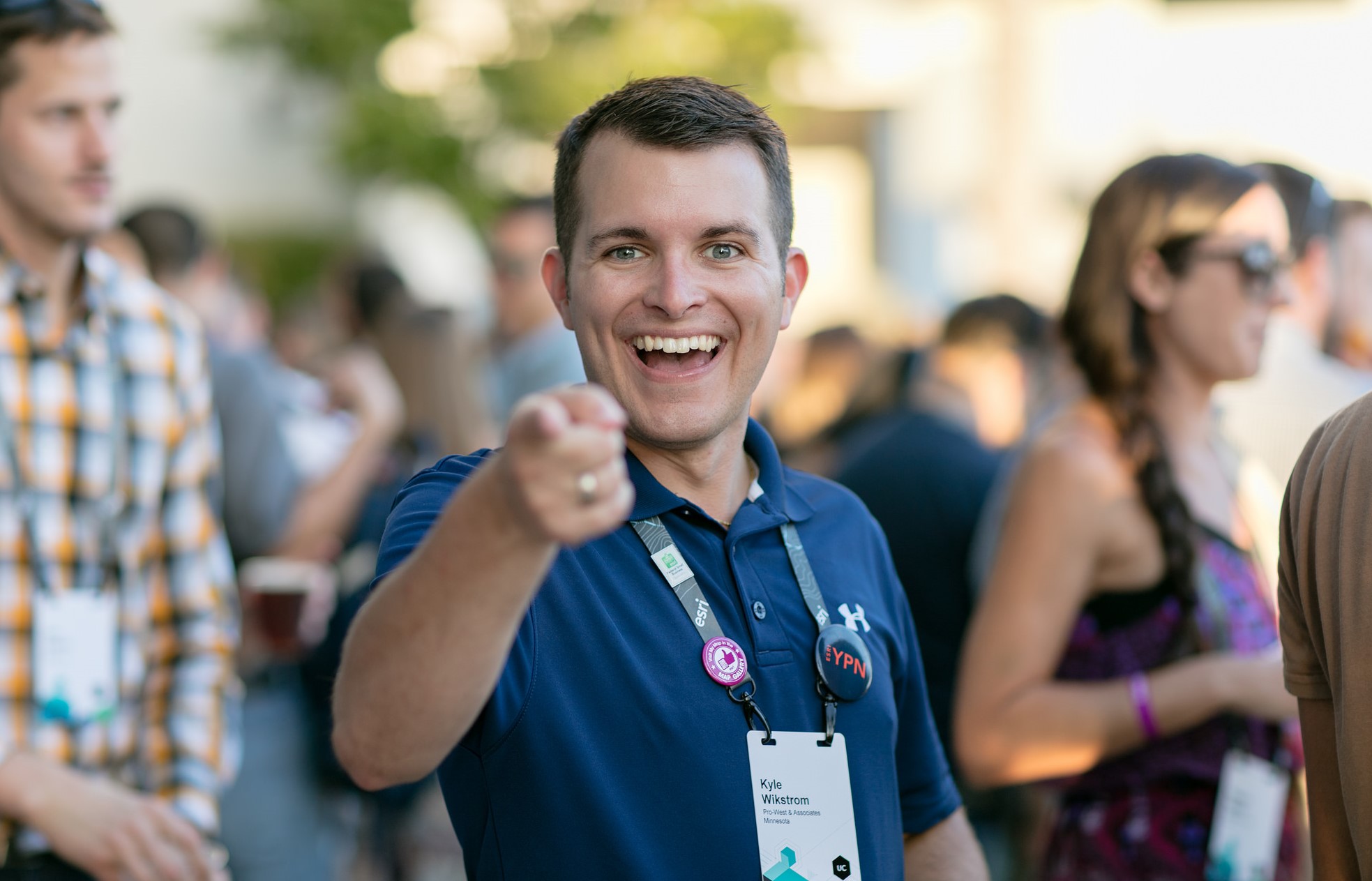 Man pointing at camera at a party