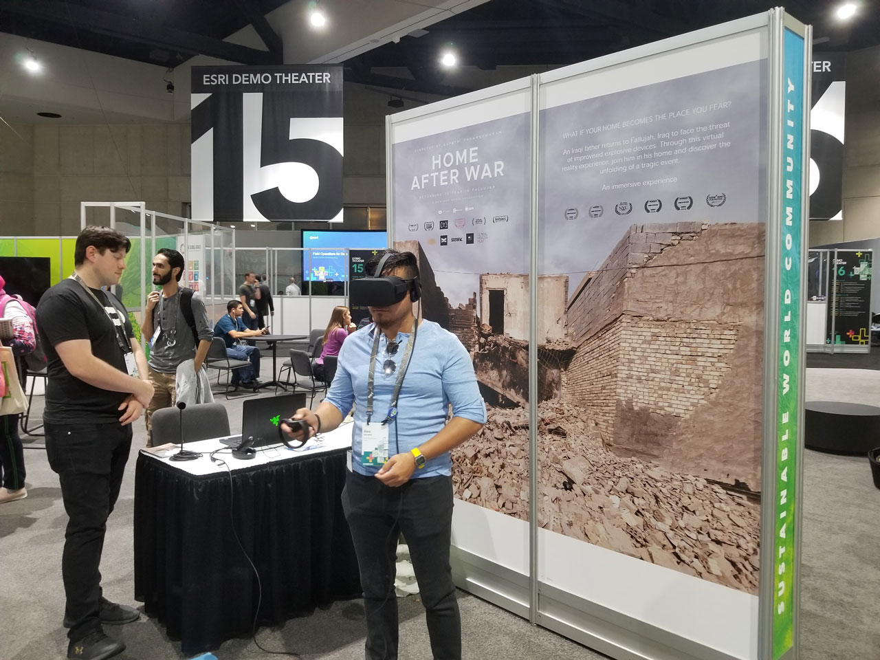 UC Attendee experiences a virtual reality story of a father in Fallujah, Iraq