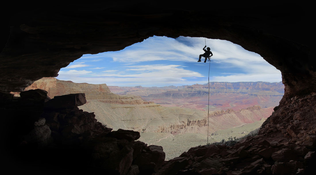 Bigfork High School student Sandy Baker rapelling into a Grand Canyon cave.