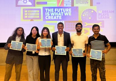 Second place winning team holding their certificates.