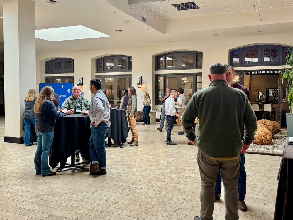 Attendees gather during a break to network and connect, building a collaborative community