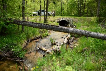 Good Culvert - This restored crossing's design took into account the hydrology of this stream at many flow types and  rehabilitation of riparian and aquatic habitat.
