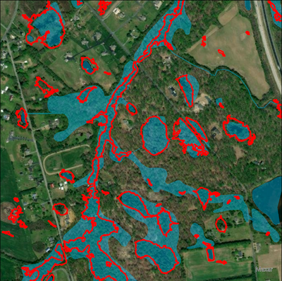 Postprocessed polygon wetland predictions (red outline), NWI reference wetlands (blue)