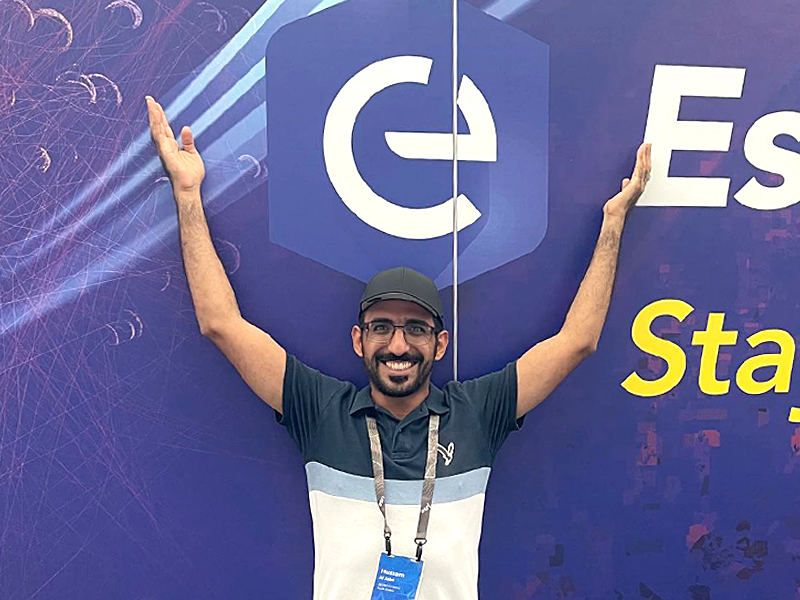 UC2023_Hussam_Posing with EC Logo.png